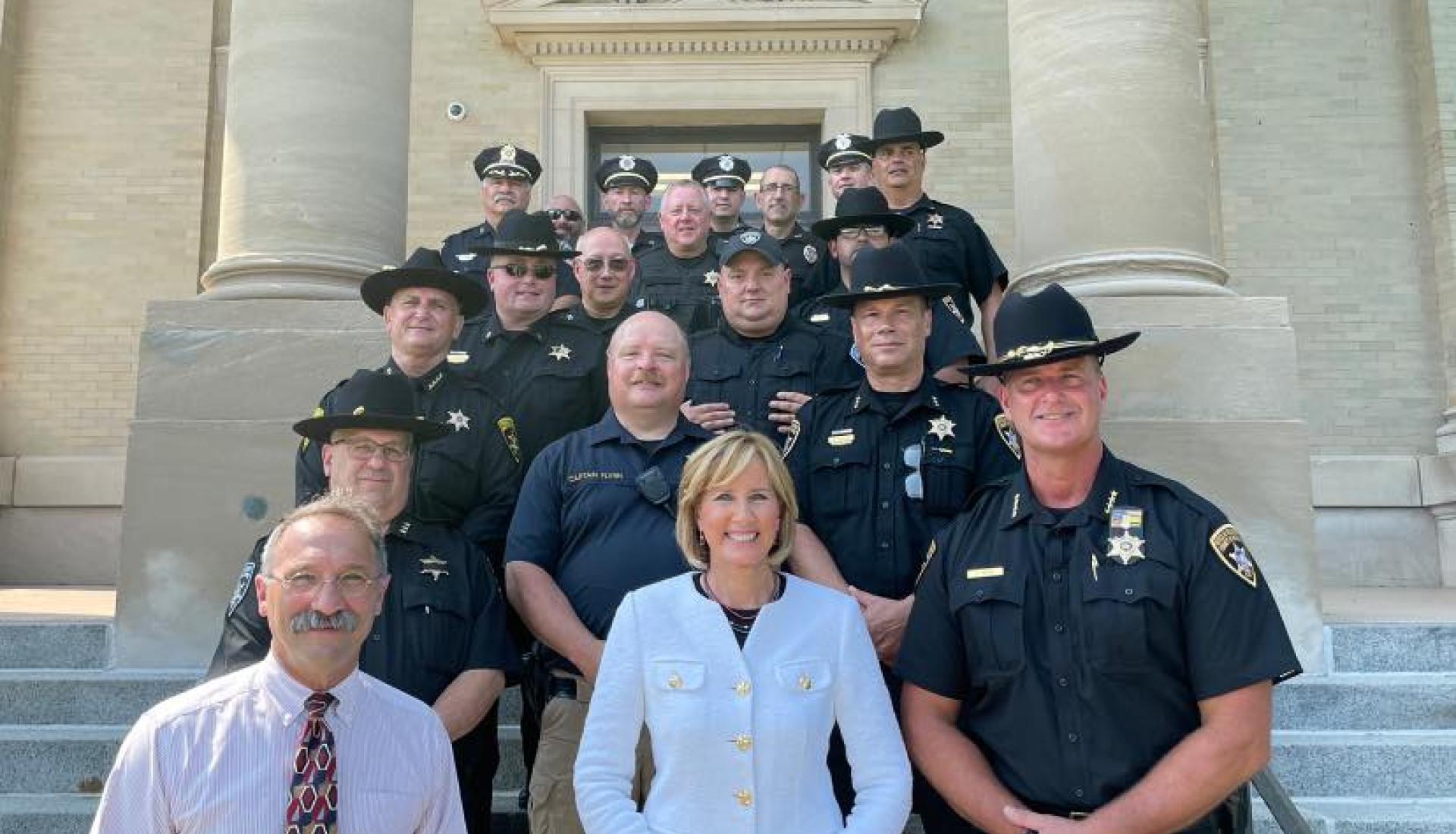Tenney Poses for Photo with Law Enforcement Officers